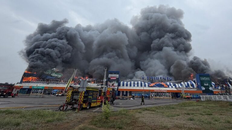 Ukrainian rescue personnel work to extinguish a fire in a damaged shopping mall following a Russian air attack in Zaporizhzhia on August 28, 2026.