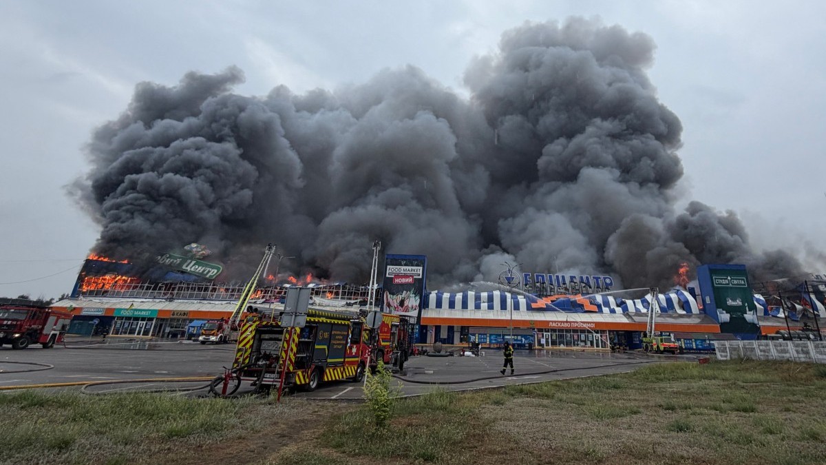Ukrainian rescue personnel work to extinguish a fire in a damaged shopping mall following a Russian air attack in Zaporizhzhia on August 28, 2026.